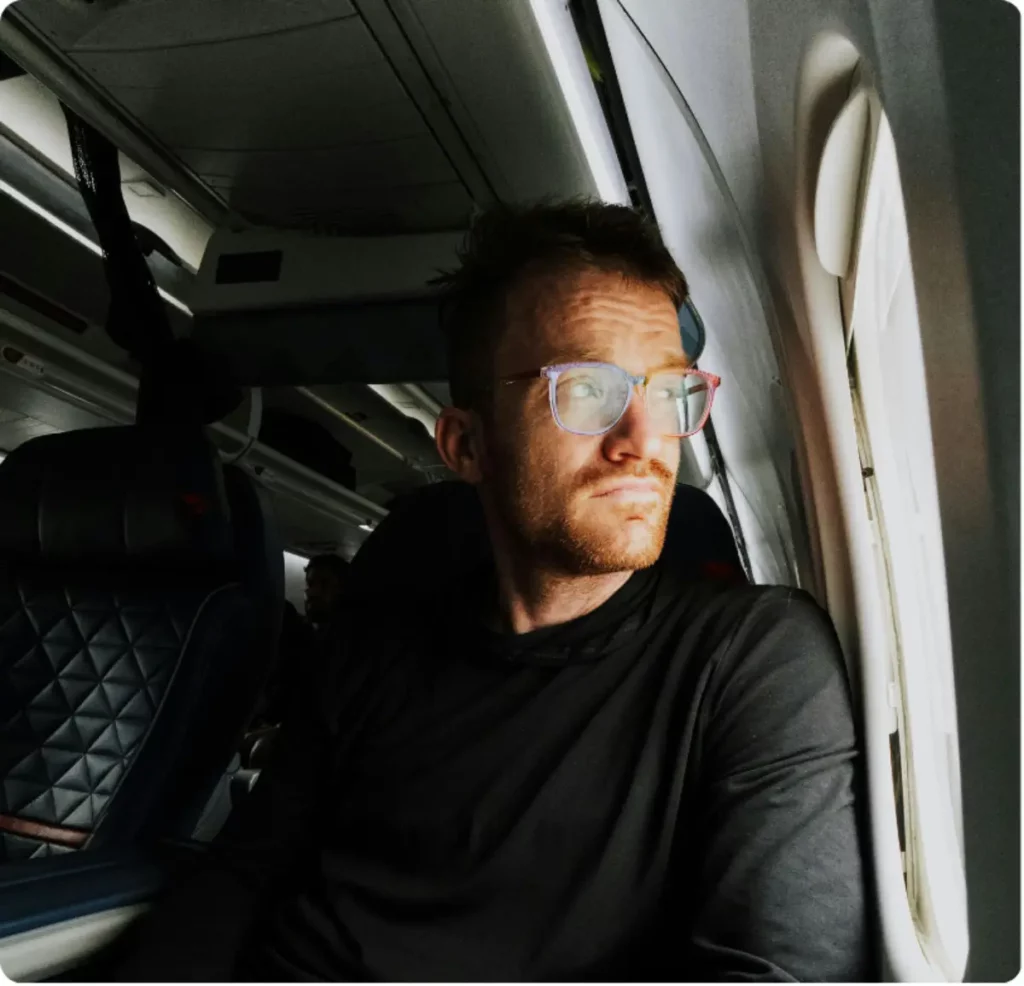 Man traveling comfortably with Legacy Healing luxury travel concierge support.